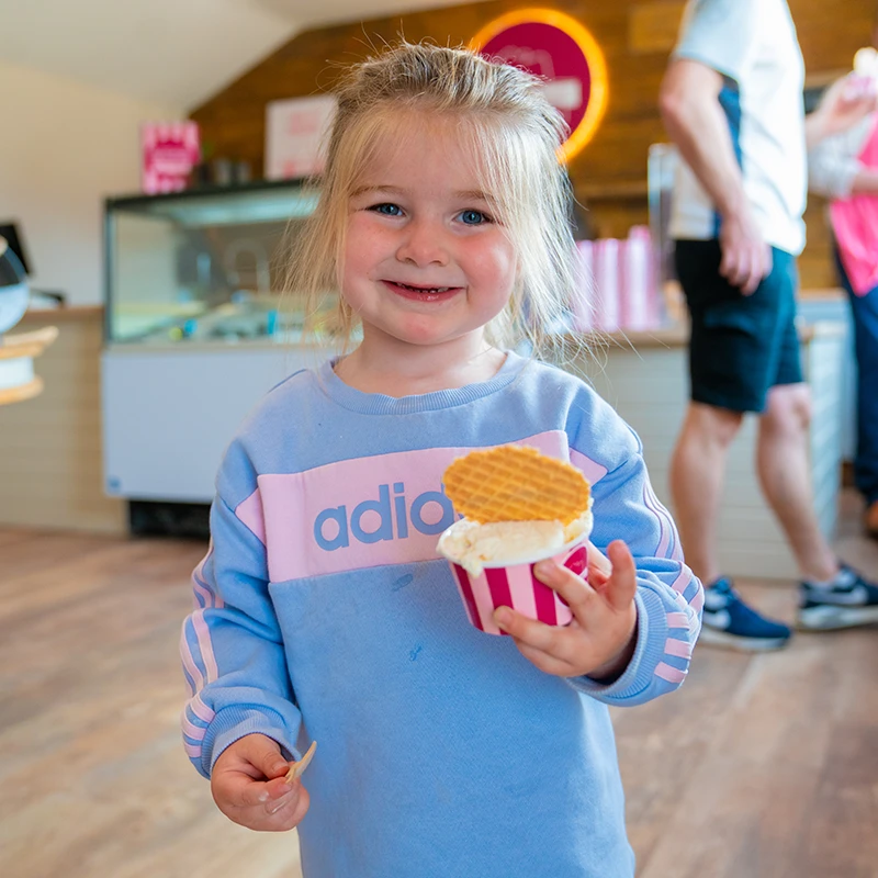 Child enjoying ice-cream at Ernespie Farm Gelato Hut